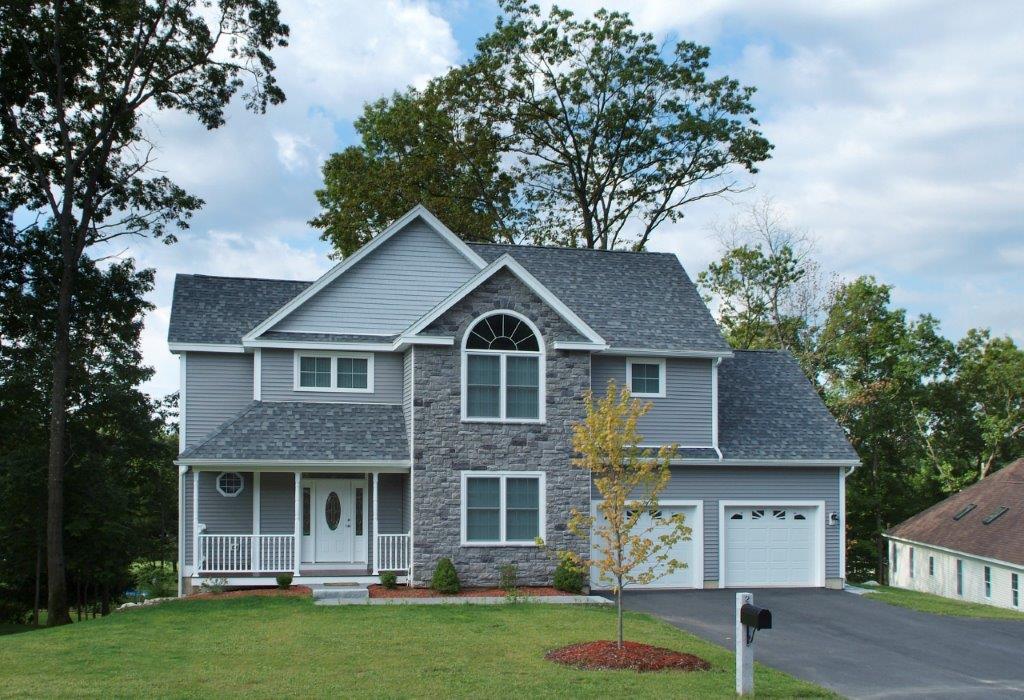 Contractor Standing In Front Custom Kitchen Construction Framing Gradating Into Finished Build